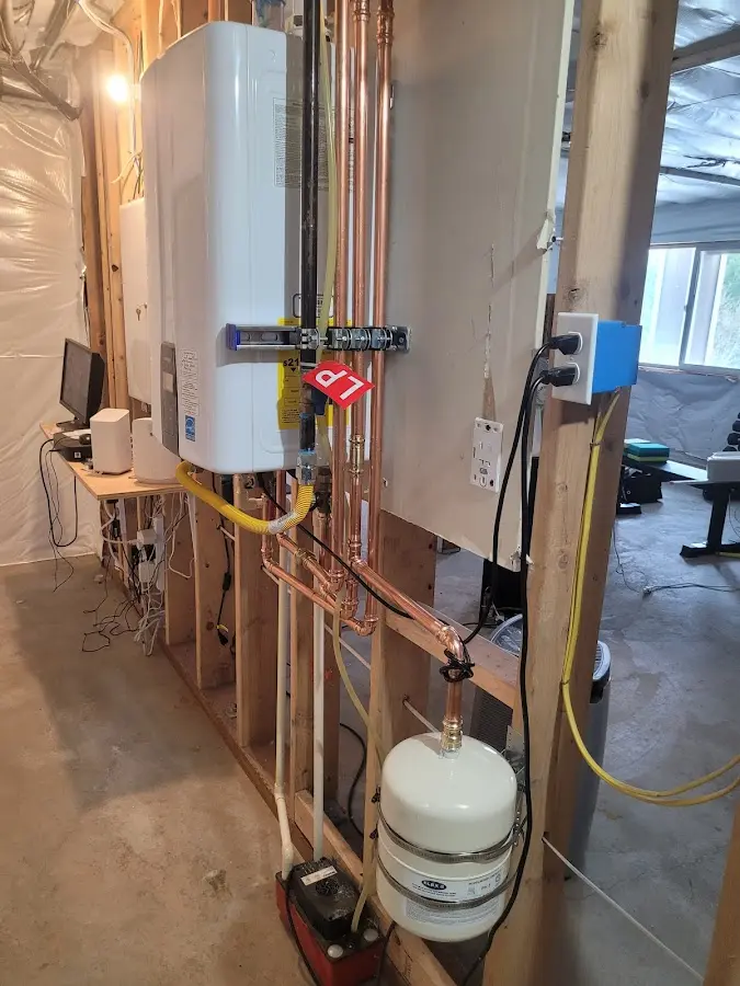 Licensed plumber repairing a kitchen sink in Toledo